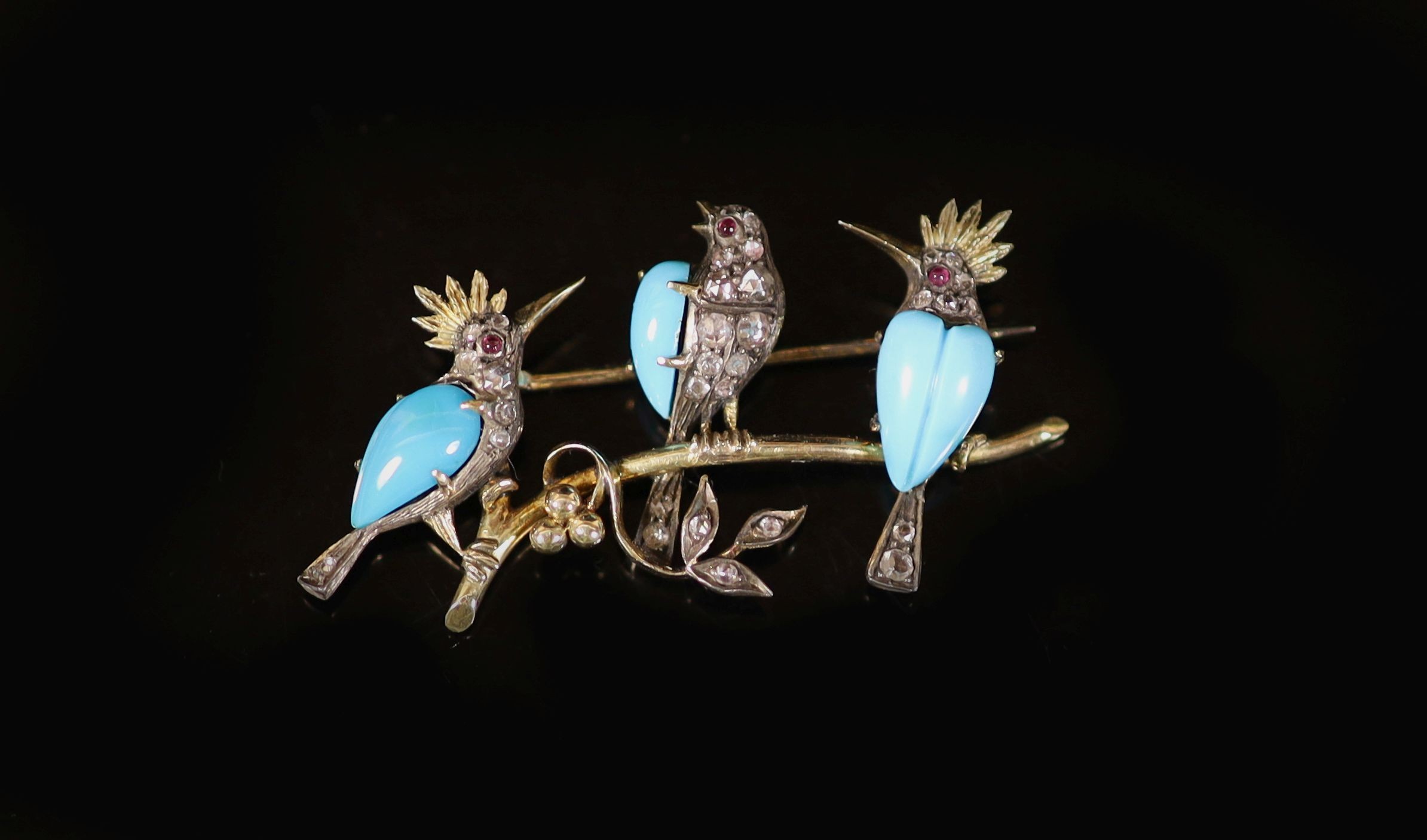An Edwardian gold, turquoise, rose cut diamond and cabochon set bar brooch, modelled as three birds on a branch